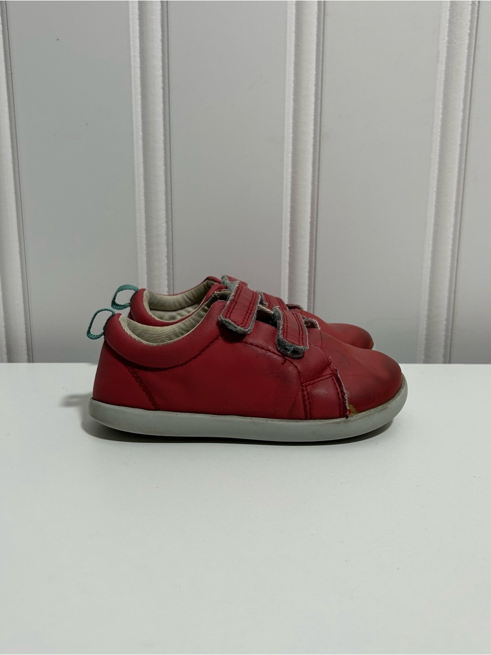 Ten little red leather strap sneakers